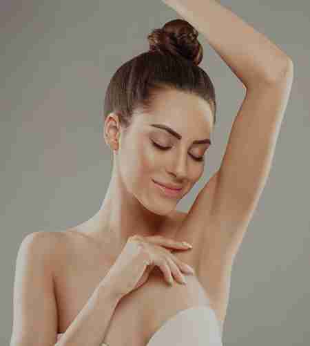 A woman satisfied with her laser hair removal therapy