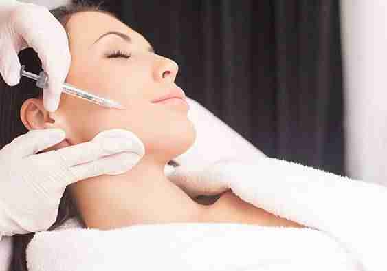 woman relaxing as she receives dermal fillers