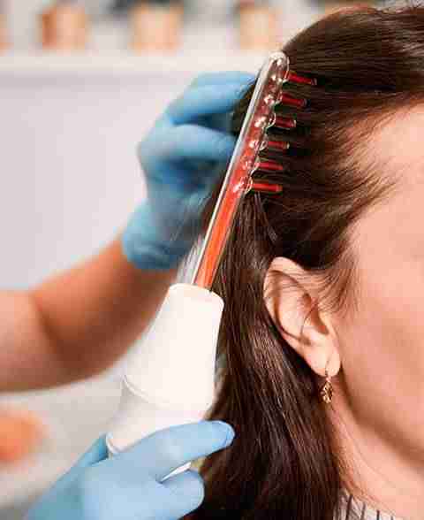 a woman getting her hair treatment