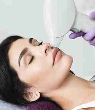 female patient undergoing laser hair removal procedure