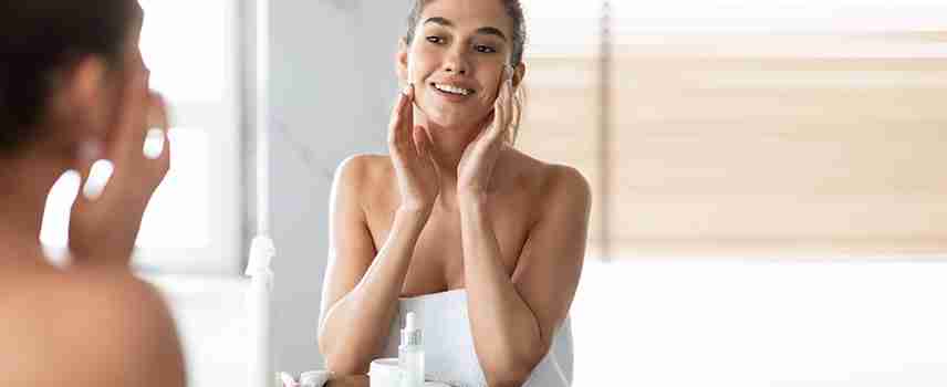 woman satisfied with non-surgical facial skincare treatment